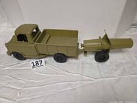 Side view of truck attached to cannon