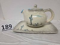 Teapot on matching tray, full view