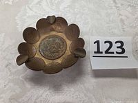 Top view of coin ashtray showing coin arrangement