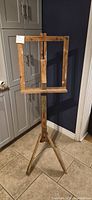 Full view of wooden adjustable tripod easel