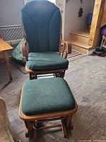 Front view of wood glider rocking chair and ottoman