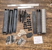 Overall view of unassembled HO scale passenger car kits and parts