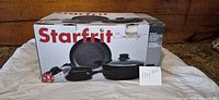 Boxed Starfrit Simplicity 5-piece cookware set showing product image and branding