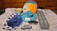 All dinnerware, spice holder, pineapple dishes, tray and molds arranged