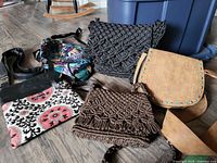 Group shot of all five purses on floor