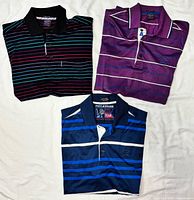 All three Paul & Shark striped polo shirts folded to show colors and patterns