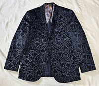 Full front view of blazer laid flat showing overall pattern and cut