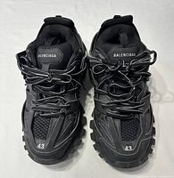 Top view of both sneakers showing uppers, laces, branding, size marking