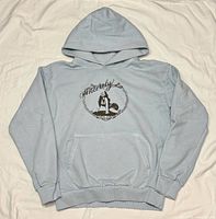 Front view of light blue Kali Uchis Sincerely Tour hoodie showing graphic and pocket