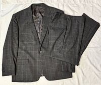 Full suit laid flat showing jacket and pants