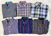 All six folded shirts showing patterns and labels