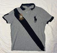 Full front view of grey Polo Ralph Lauren shirt with navy diagonal stripe and logos