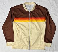 Front view of bomber jacket laid flat showing color blocks, stripes and overall design