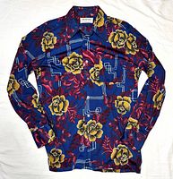 Full front view of shirt laid flat