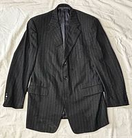 Full view of blazer front showing pinstripe pattern, lapels, pockets, overall appearance