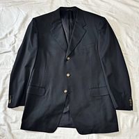Full front view of navy blazer showing overall condition and design
