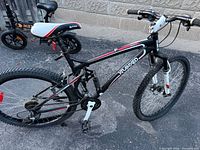 Full side view of the Kranked mountain bike showing frame, drivetrain and missing right pedal