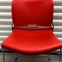 Front view showing red seat, backrest and vent slot