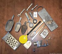 All 16 metal kitchen items laid out on table
