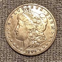 Obverse of 1896 Morgan silver dollar showing Liberty head and date