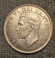 Obverse of 1952 Canadian dollar showing portrait and legend