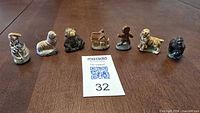All seven Wade figurines lined up for size and condition reference