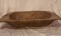 Overall view of wooden dough bowl front profile