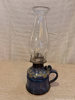 Full view ceramic hurricane lamp with chimney