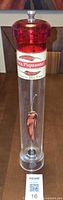 Full view of tall clear pepper grinder