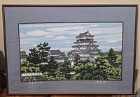 Full view of framed textile artwork