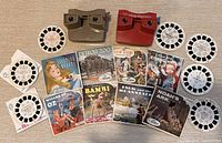 Overall lot showing two viewers, multiple storybook packets and loose reels