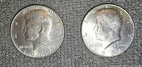 Obverse of two 1967 Kennedy half dollars