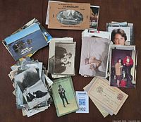 Overview of assorted postcard stacks showing quantity and variety