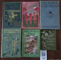 Six early 1900s hardcover children’s novels arranged front covers visible
