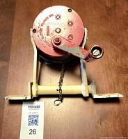 Full view of siren on bracket with crank handle and measurement reference