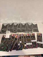 All 20 sealed packs laid out showing fronts and size labels