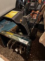 Front view showing 24-inch auger housing, chute, controls