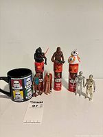 Group shot showing mug, three sound talkers and five figures