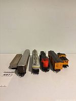 All six model train pieces lined up front view