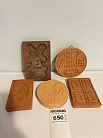 All five wooden butter molds grouped for overview