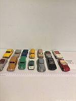Group shot of 16 Dinky diecast cars lined up