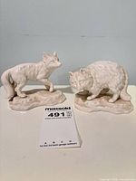 Overall view of both porcelain figurines on bases