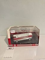 Front and side view of boxed GM Futurliner model