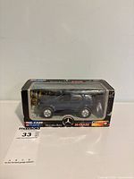 Front and side view of boxed Mercedes-Benz M-Class model