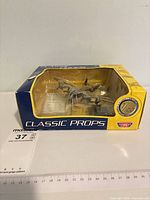 Boxed Avro Lancaster model showing window packaging and Maxsold lot tag