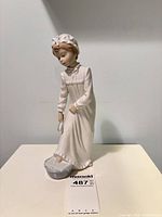 Full view of figurine showing pose and overall condition