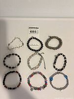 All nine bracelets laid out in grid formation