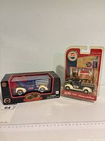 Both boxed Pepsi-Cola die-cast vehicles side by side