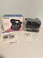 Camera with box, manual and paperwork