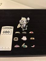 All nine rings displayed in jewellery tray with Umbra monkey ring holder